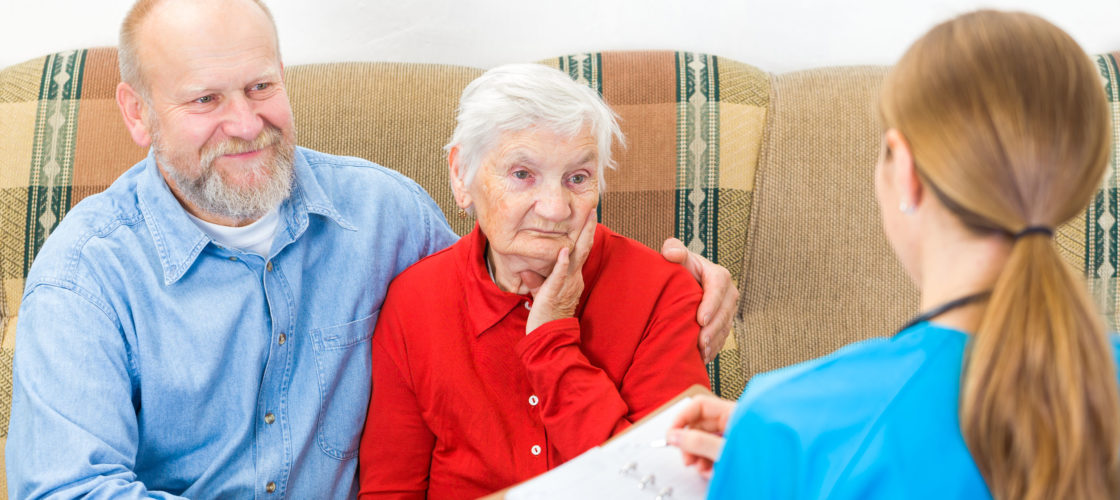 Son and elderly mother with  helpful staff person