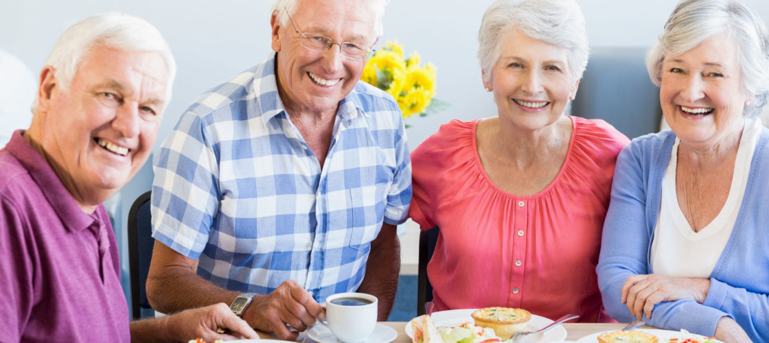 two older couples enjoying lunch together