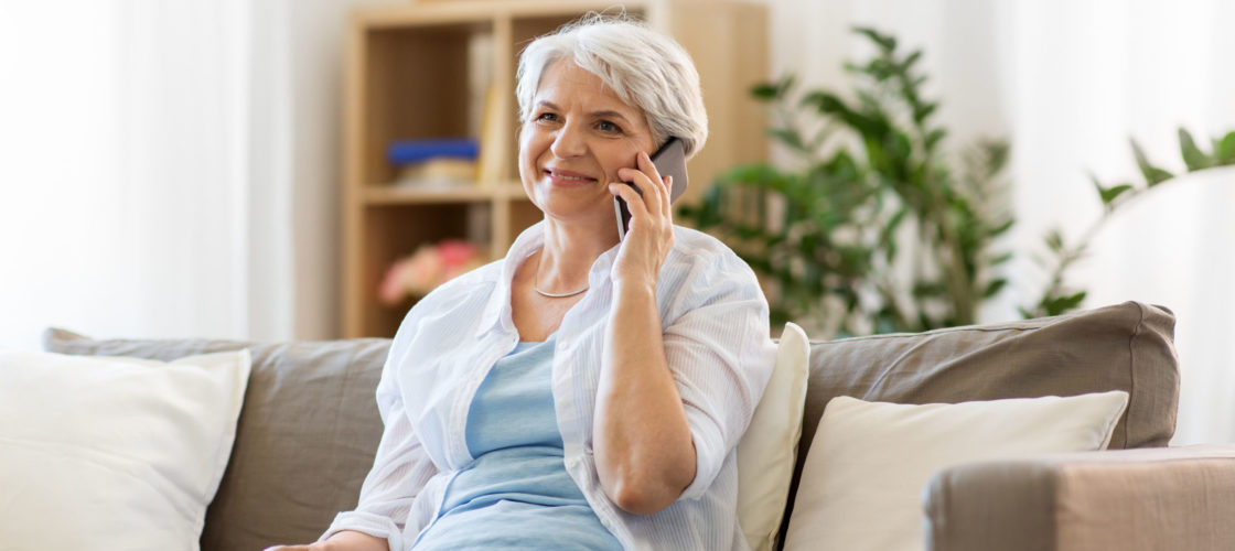 Older woman on phone at home